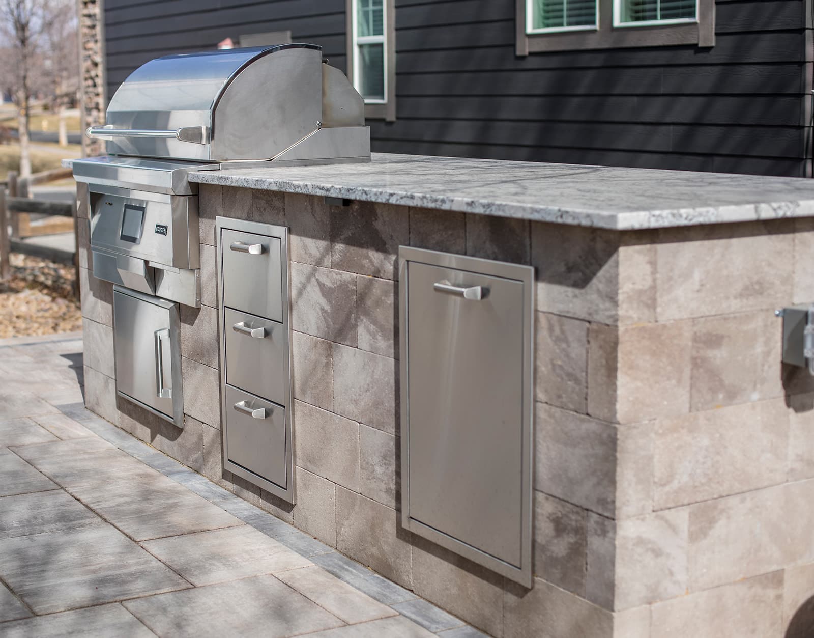 Complete backyard transformation with Belgard pavers and stone steps in Boulder, Colorado