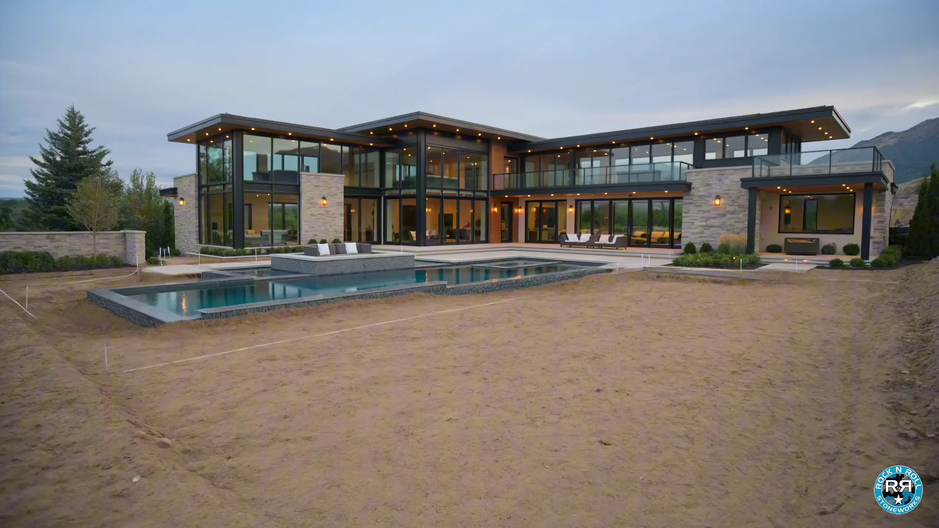 The Johnson Estate pool, spa, and outdoor living build at dusk in Colorado
