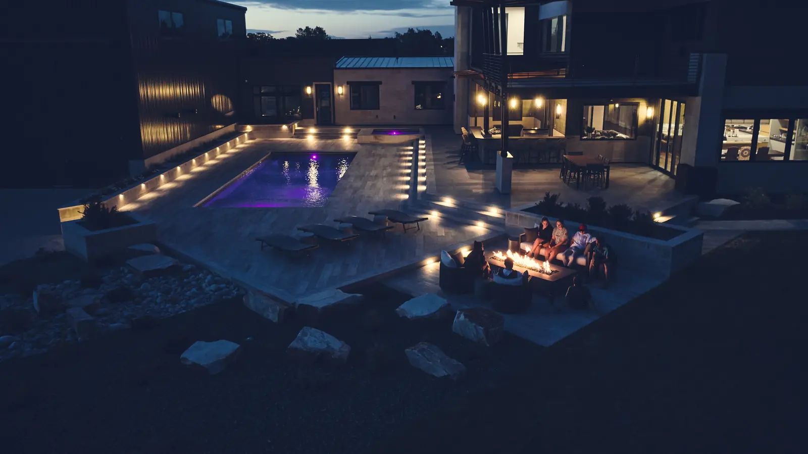 Dusk view of a full-property backyard build at the Johnson Estate in Colorado