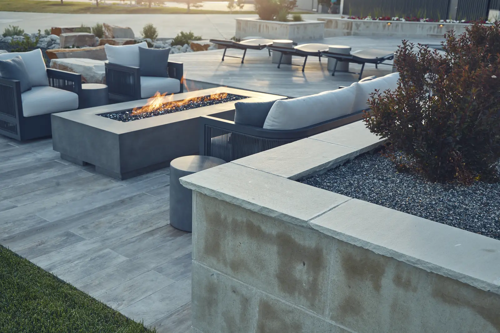 Sunken fire lounge with outdoor sofas, concrete fire table, and limestone seat wall, Johnson Estate, Colorado