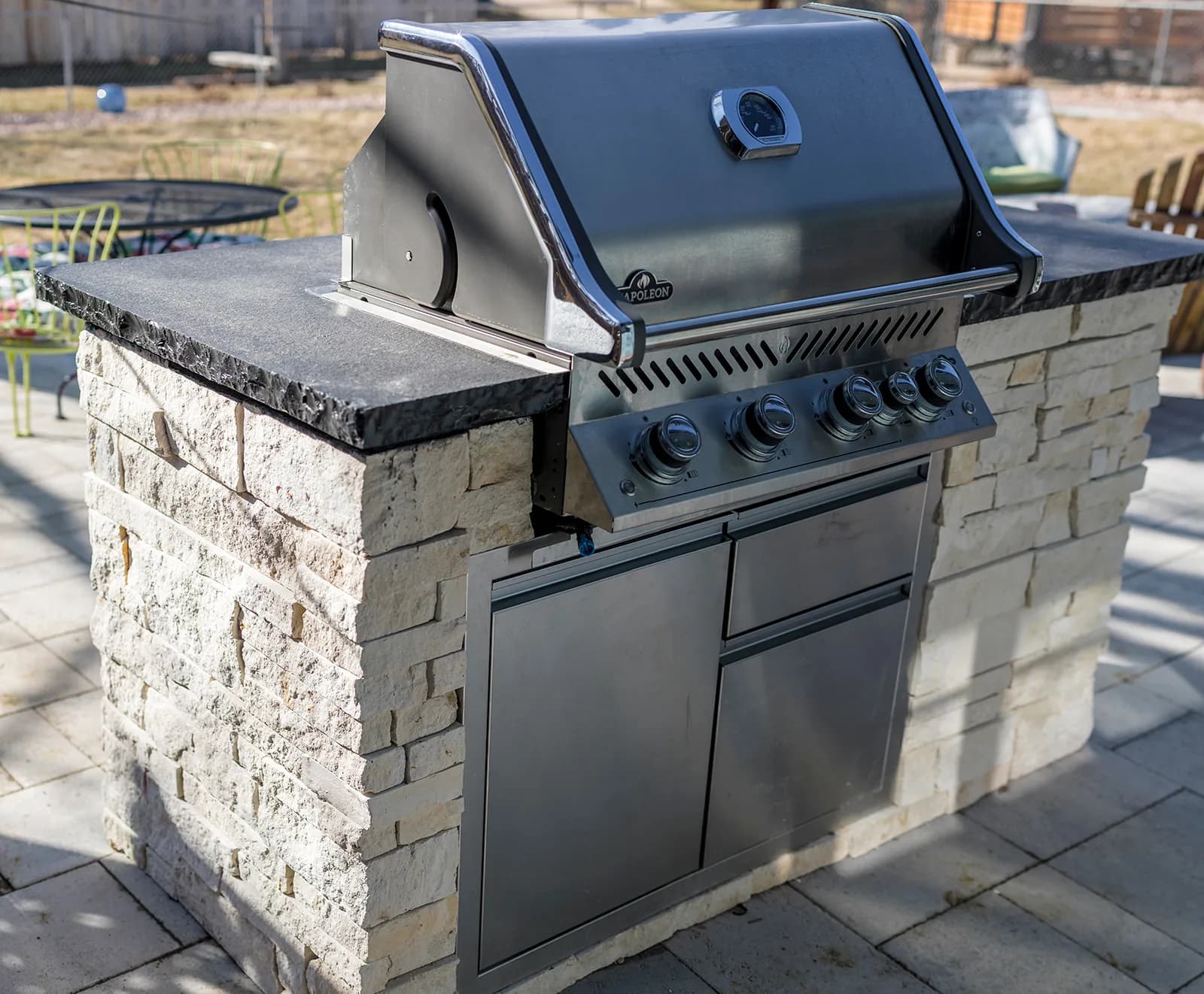 Complete outdoor living space with fire pit and paver patio in Colorado